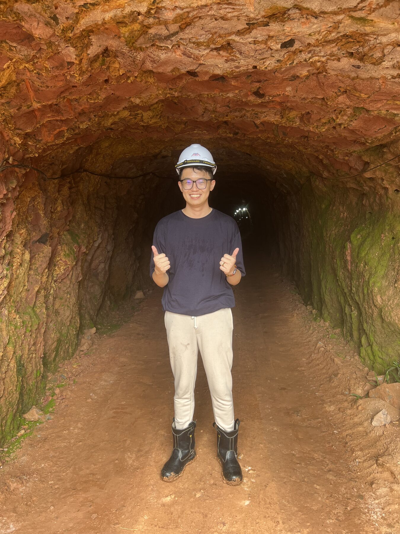 Underground exploration tunnel at the Bukit Kachi tin mine, Malaysia — on-site inspection of a working adit during a tin field exploration visit.